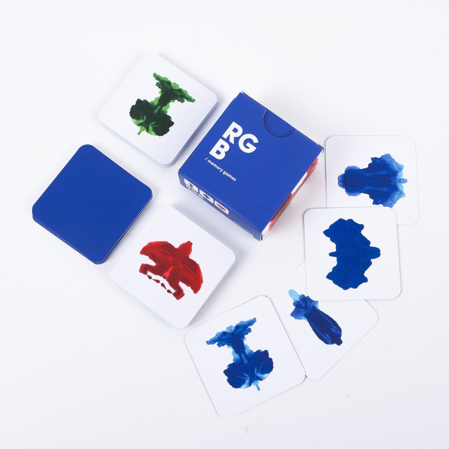 RGB Abstract memory game. Color swatch cards with blue, red, and green ink samples on a white background